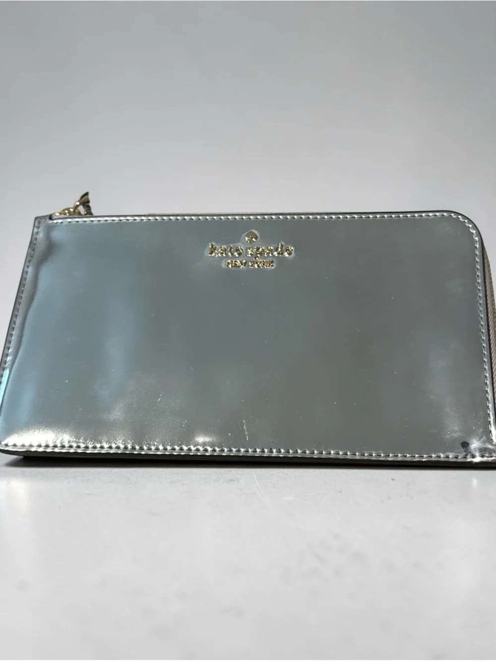 kate spade New York Lucy Metallic Silver L Zip-Around Wristlet new